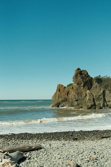 Large rock formation in the ocean.