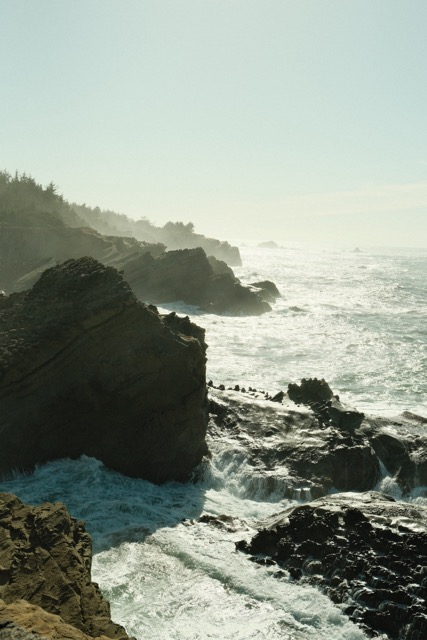 A west coast cliffside with large rock formations.